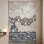 A premium-grade kids' rug featuring a highly durable, high-quality build that withstands constant activity. The pile is tightly woven to be incredibly soft and smooth, creating a comfortable surface for toys and games. The design showcases a weathered abstract center in neutral tones, finished with a clean geometric frame.