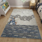 A premium-grade kids' rug featuring a highly durable, high-quality build that withstands constant activity. The pile is tightly woven to be incredibly soft and smooth, creating a comfortable surface for toys and games. The design showcases a weathered abstract center in neutral tones, finished with a clean geometric frame.