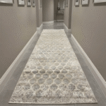 Showcases rich, intricate tribal patterns woven into a low-profile construction, making it perfect for smooth door clearance in entryways.