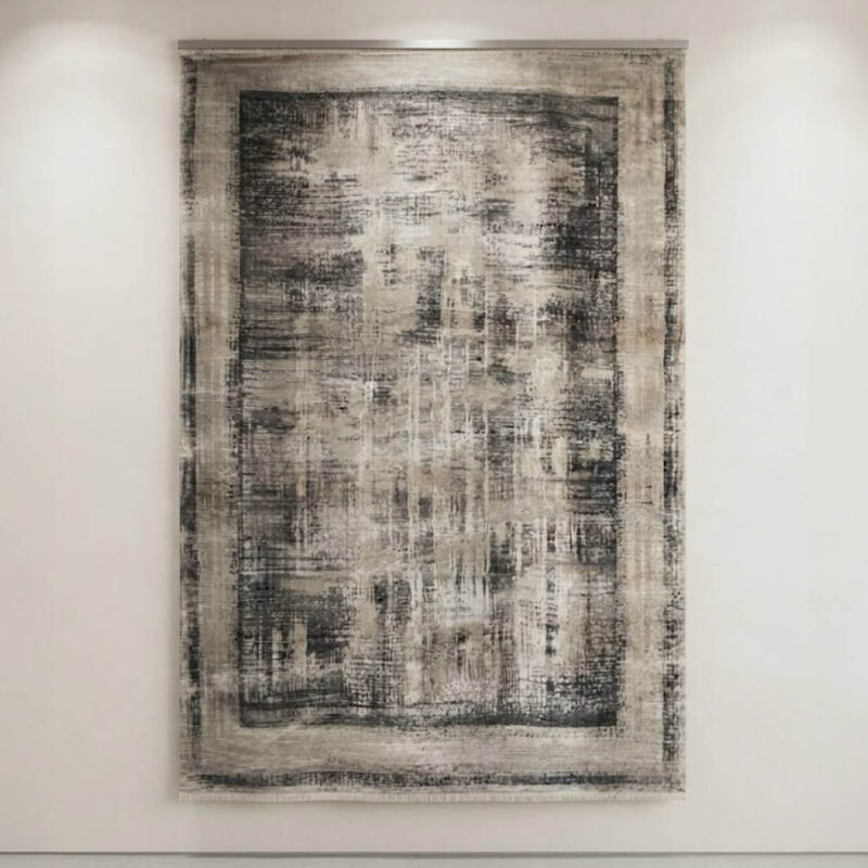 This-rug-features-an-understated-abstract-design-in-tones-finished-with-a-defined-geometric-border-along-the-edges