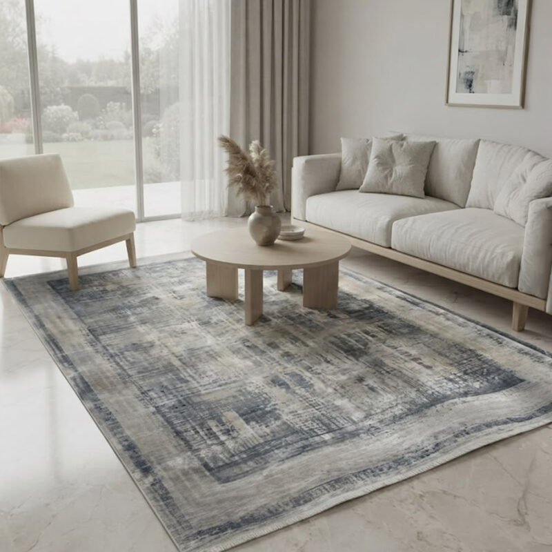 This-rug-features-an-understated-abstract-design-in-tones-finished-with-a-defined-geometric-border-along-the-edges