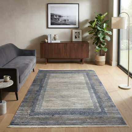 This soft-textured area rug combines a clean, neutral look with a distressed abstract design. Its smooth pile offers a premium feel underfoot while looking sharp on any floor.