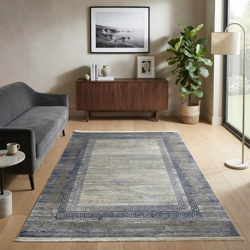 This soft-textured area rug combines a clean, neutral look with a distressed abstract design. Its smooth pile offers a premium feel underfoot while looking sharp on any floor.
